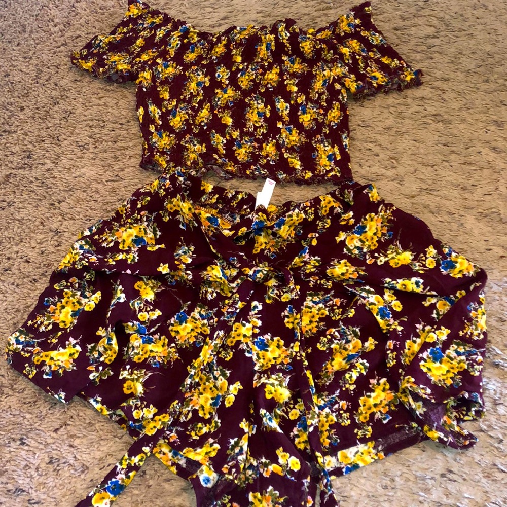 Medium 2 piece short/skort set with stretchy top.